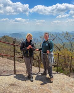 In many ways it was a resounding hike. Thirteen hours from the lower car park and back. Jirisan is a steep course. The hike up to Cheonwangbong (1915m) is 1300m in only 5km. This was a good reminder for my two American guests. I find it hard to determine the exact time it will take to do the loop course. 8-12hrs. Big variance. 
It was a pearler of a day. The weather was stunning. Spring greens and a heaven blue sky. A cool zephyr. At the summit area it was windier and colder. Even in the afternoon, hoar frost 상고대 stuck horizontally from trees and remained in the cracks of rocks. 
The only thing open by the time we get back to the dark, still carpark was the GS25. It had a low-lit hall with a black backdrop. A few misfit night hikers sat at some the tables. We cooked our noodles at the hot water dispenser, threw in some soft boiled eggs, cheese, took a table and washed it down with cold beer. Fantastic achievement for them two. Strong memories of Korea from this. They never shirked for a moment. Chur.
