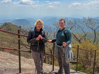 In many ways it was a resounding hike. Thirteen hours from the lower car park and back. Jirisan is a steep course. The hike up to Cheonwangbong (1915m) is 1300m in only 5km. This was a good reminder for my two American guests. I find it hard to determine the exact time it will take to do the loop course. 8-12hrs. Big variance. 
It was a pearler of a day. The weather was stunning. Spring greens and a heaven blue sky. A cool zephyr. At the summit area it was windier and colder. Even in the afternoon, hoar frost 상고대 stuck horizontally from trees and remained in the cracks of rocks. 
The only thing open by the time we get back to the dark, still carpark was the GS25. It had a low-lit hall with a black backdrop. A few misfit night hikers sat at some the tables. We cooked our noodles at the hot water dispenser, threw in some soft boiled eggs, cheese, took a table and washed it down with cold beer. Fantastic achievement for them two. Strong memories of Korea from this. They never shirked for a moment. Chur.
