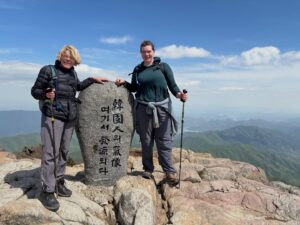 In many ways it was a resounding hike. Thirteen hours from the car park and back. Jirisan is a steep course. The ascent to Cheonwangbong (1915m) is 1300m in only 5km. It was a good reminder for my two American guests. I always find it hard to determine the exact time it will take to do the loop course. 8-12hrs. 
It was a pearler of a day. The weather was stunning. Spring greens and heaven blue sky. A cool zephyr. At the summit area it was much windier and cooler. A hoar frost and sleet 상고대 stuck to the trees and inside rocks. 
The only thing open by the time we get back to the dark and still carpark was the GS25. It had an excellent hall out the back with tables and chairs, and a couple of posse&rsquo;s of misfit late night hikers. Hot water area for cooking noodles which is what we did with a beer. Fantastic achievement for them two. Strong memories of Korea from this. They never shirked for a moment. Chur.